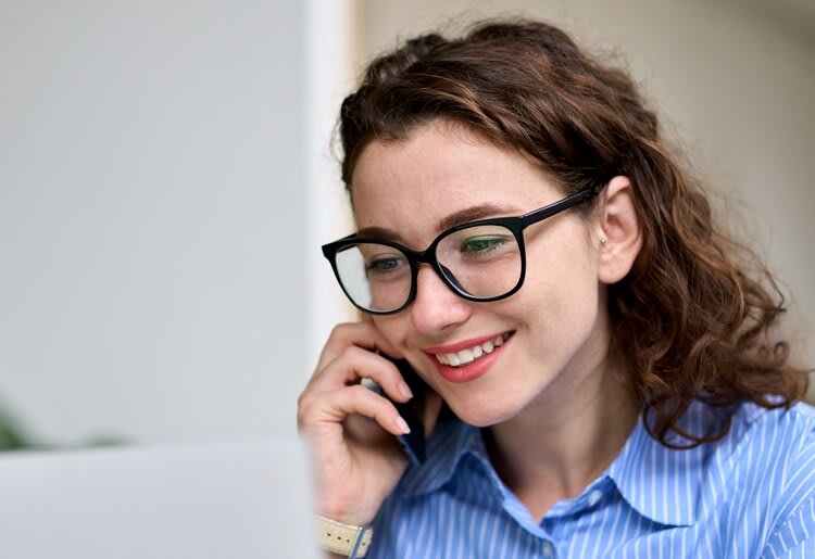 Woman on the phone at work.